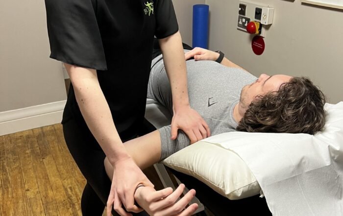 Physiotherapist Alice Matravers Treating A Patient In NW3