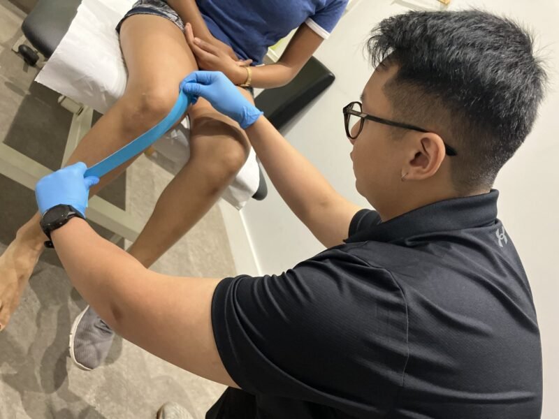 BOOST PHYSIO physiotherapist treating a patient's knee
