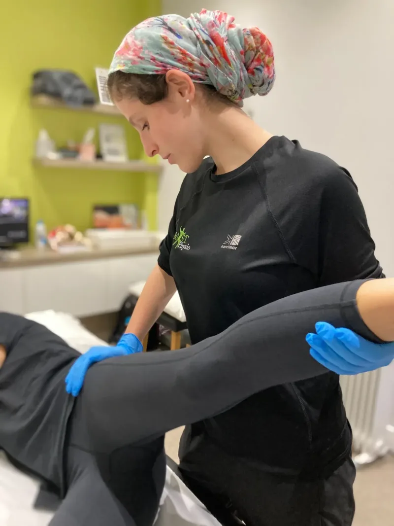 BOOST PHYSIO physiotherapist moving a patient's leg to mobilise the sciatic nerve