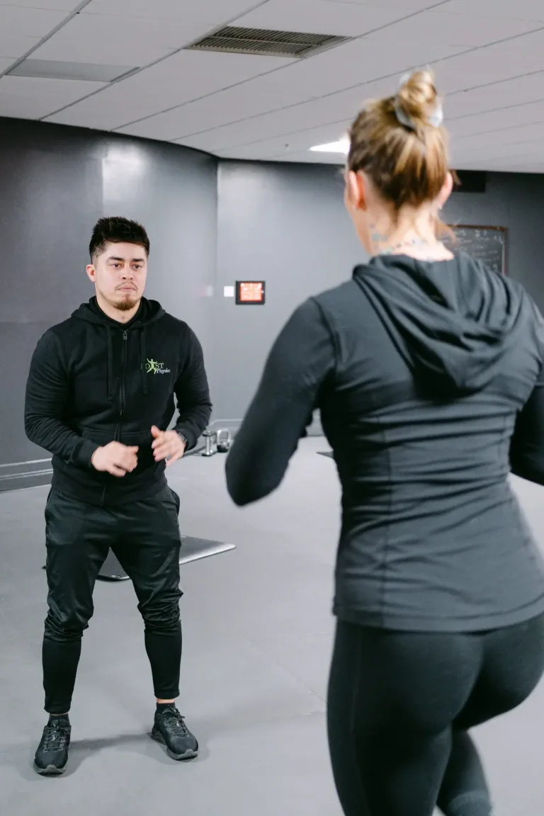 Dan Burgin coaching a patient through exercise rehab