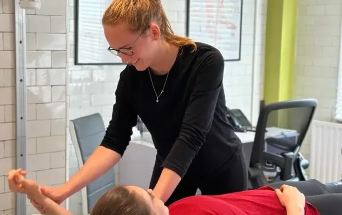 Madeleine Paterson Physiotherapist In NW3 Treating a patient