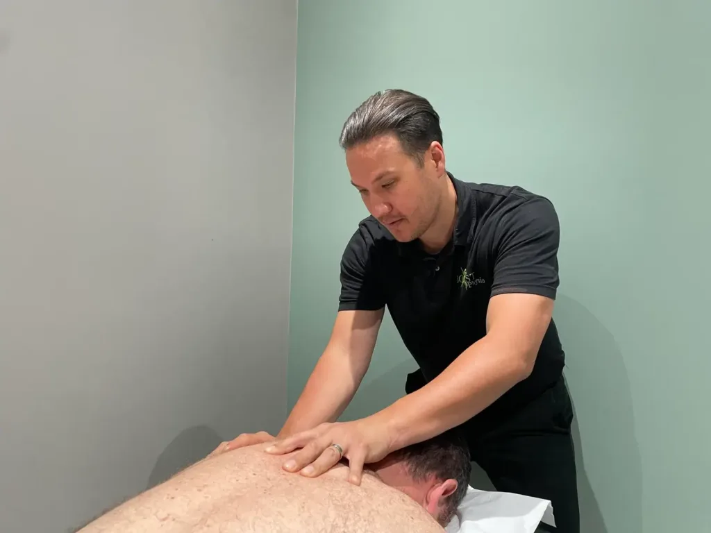 Physiotherapist using hands on treatment in Muswell Hill clinic