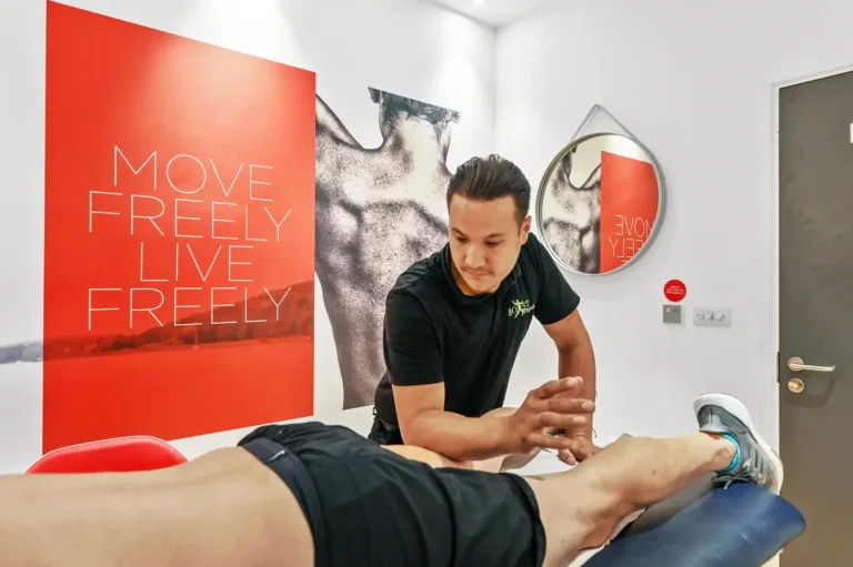 A BOOST PHYSIO physiotherapist treating a hamstring injury
