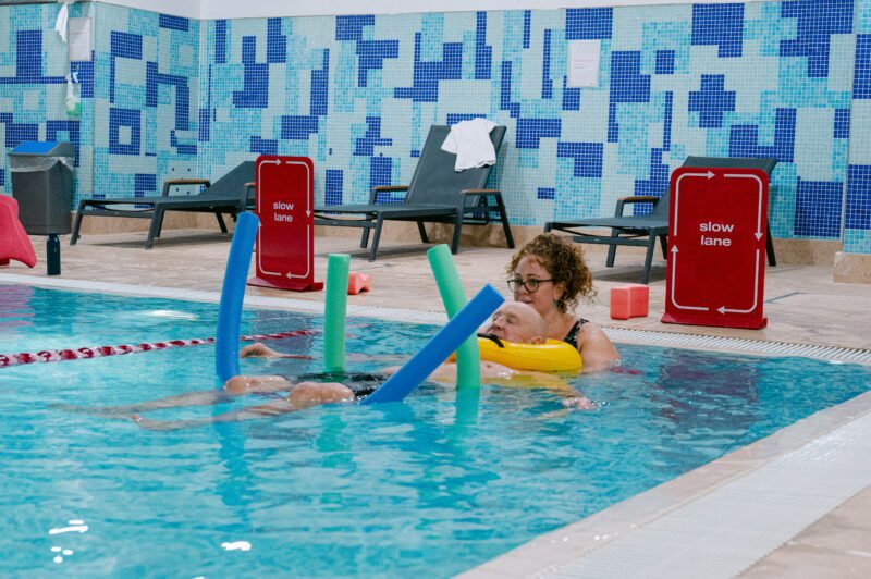BOOST PHYSIO physiotherapist guiding a patient through hydrotherapy exercises in a warm pool