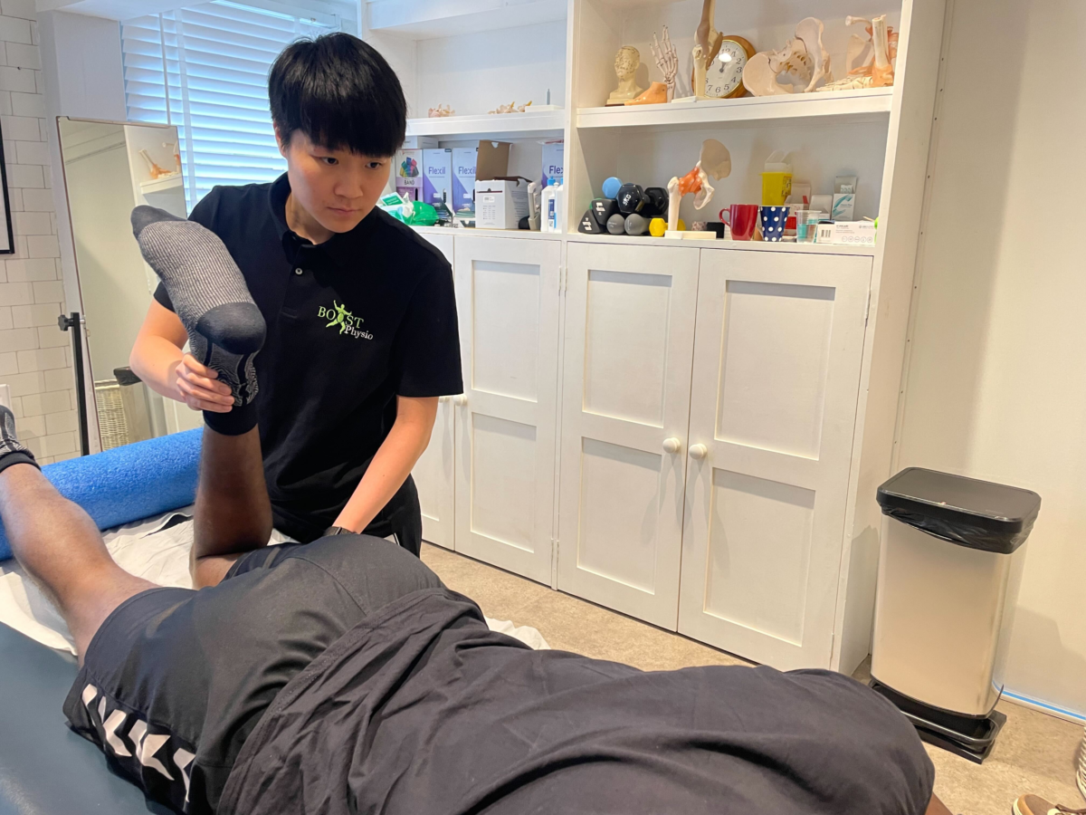 BOOST PHYSIO physiotherapist Lydia treating a patient's hip and groin
