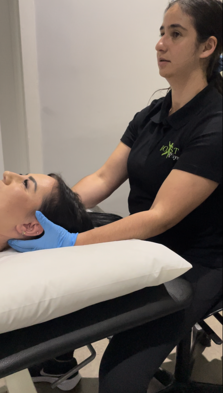 Sarah treating a patient with dizziness (BPPV) in Hendon
