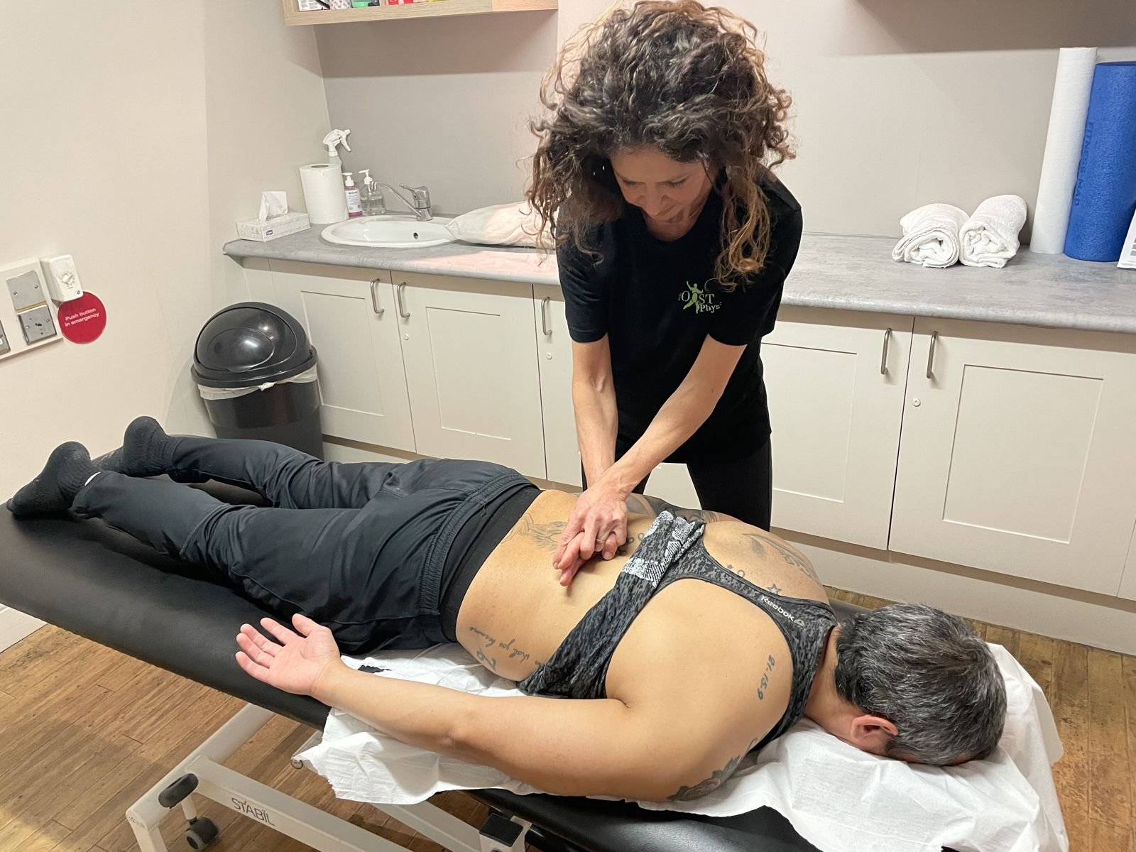 BOOST PHYSIO physiotherapist giving hands-on treatment for low back pain