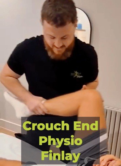 Finlay giving hands-on treatment at BOOST PHYSIO Crouch End